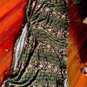 It’s a green n pink n white n black  skirt with slits up the legs